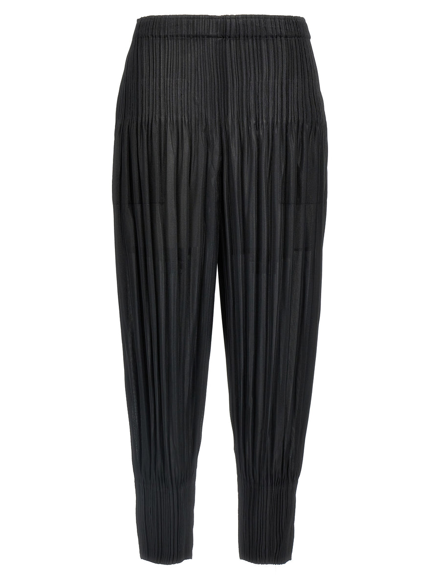 Pleats Please Issey Miyake 100% polyester trousers in black