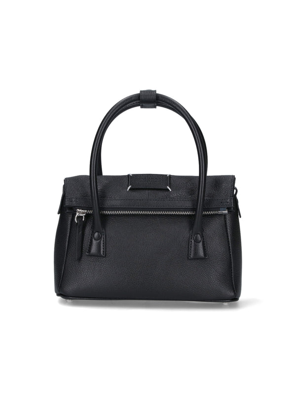 Maison Margiela Goat Leather. Lining: Polyester. Metal Parts: Zama top handle bag in black