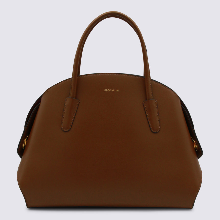 Coccinelle 100% Leather top handle bag in cognac