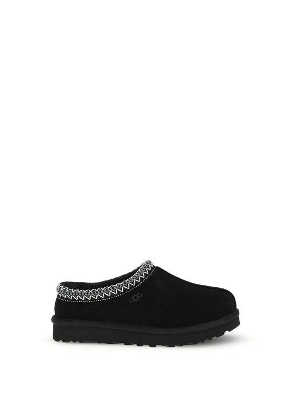 UGG Upper: 100% mutton; Sole: 100% rubber mule in black