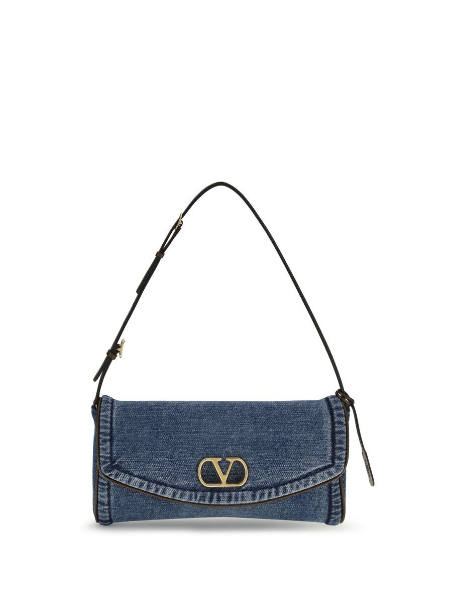 Valentino Garavani 100% Cotton (denim body); grained calfskin; antique brass-finish hardware; canvas lining shoulder bag in blue