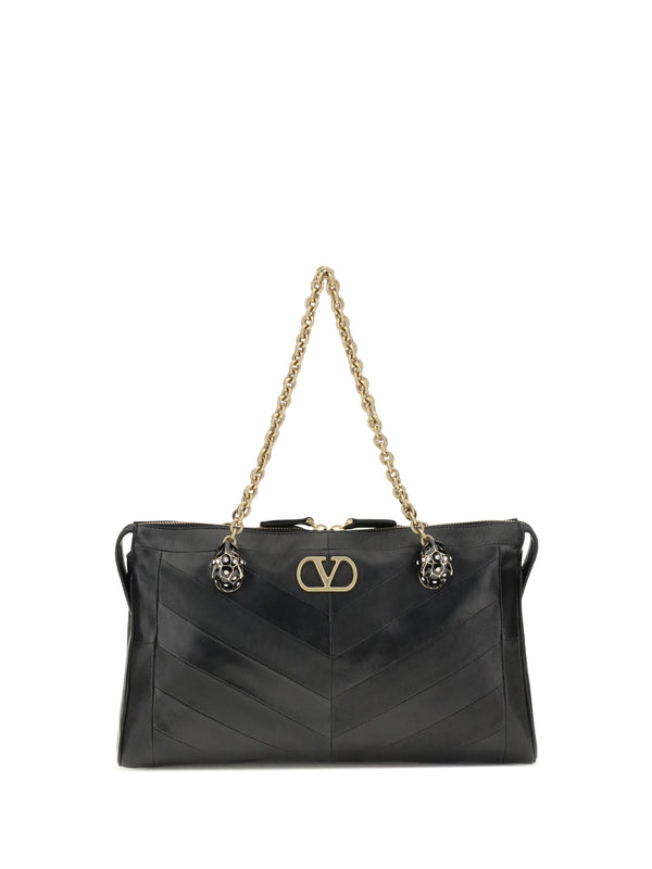 Valentino Garavani Lamb suede and glossy nappa leather shoulder bag in black