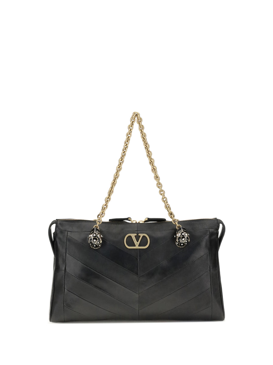 Valentino Garavani Lamb suede and glossy nappa leather shoulder bag in black