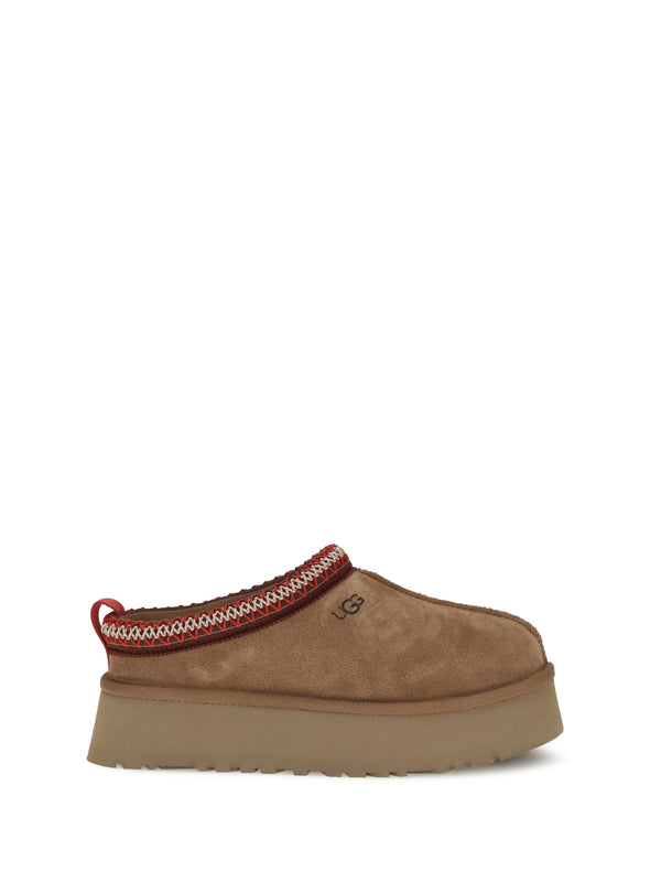 UGG Upper: 100% Suede; Sole: 100% Rubber slipper in chestnut