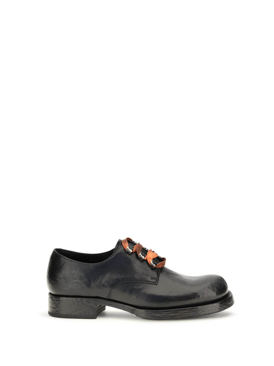 Prada Upper: 100% calf leather; Sole: 100% rubber oxford in black