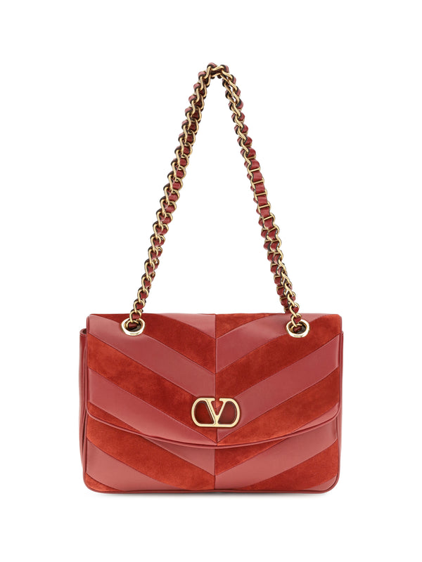 Valentino Garavani 40% suede; 60% nappa leather shoulder bag in red