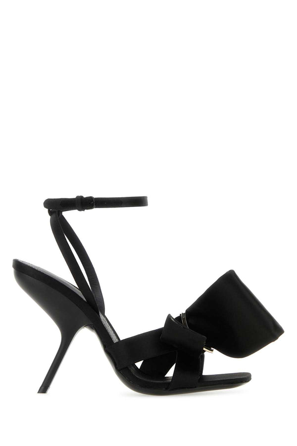 Ferragamo Exterior: 100% Fabric; Interior: 100% Leather; Sole: Leather heel sandal in black