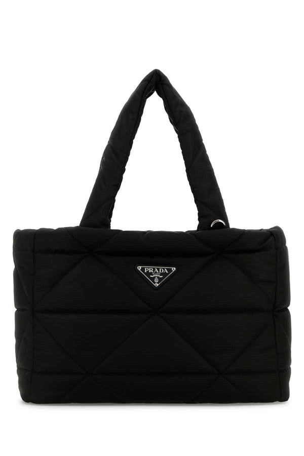 Prada Exterior: 100% Nylon. Lining: 100% Fabric. Finishing: Silver metal. shoulder bag in black