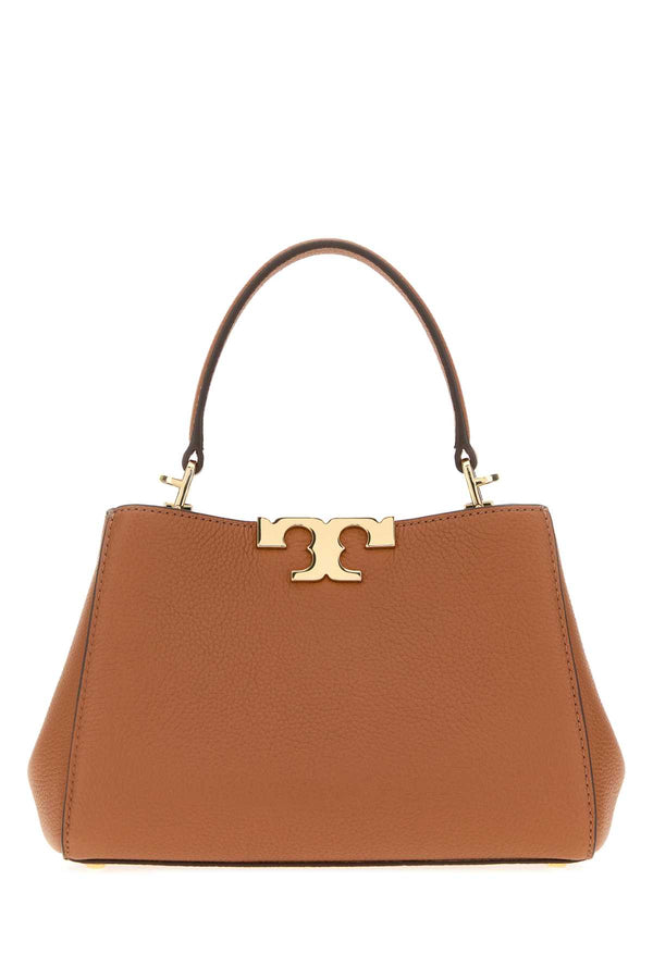Tory Burch Soft Exterior: 100% Leather top handle bag in tan