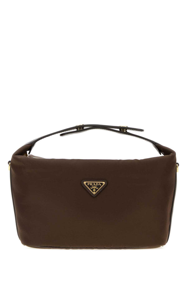 Prada Exterior: 100% Nylon (Re-Nylon fabric); Lining: 100% Fabric; Finishing: Golden metal shoulder bag in brown