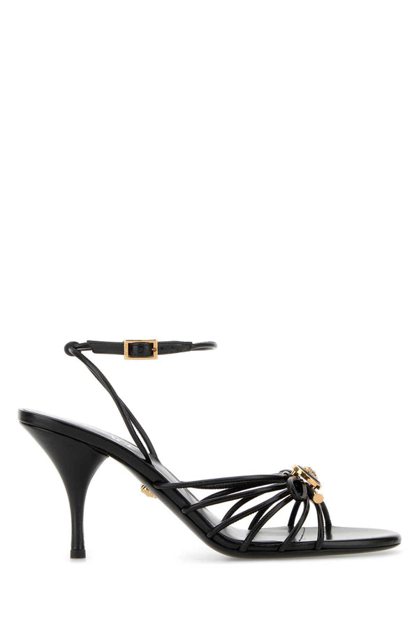 Versace Lamb Exterior: 100% Nappa leather; Interior: 100% Leather; Sole: Leather sandal in black