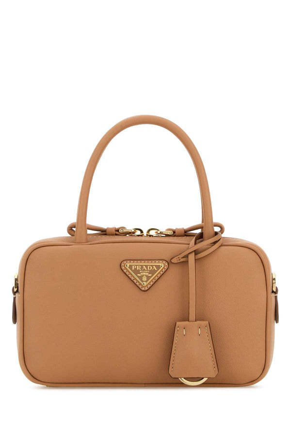 Prada Exterior: 100% Leather top handle bag in tan