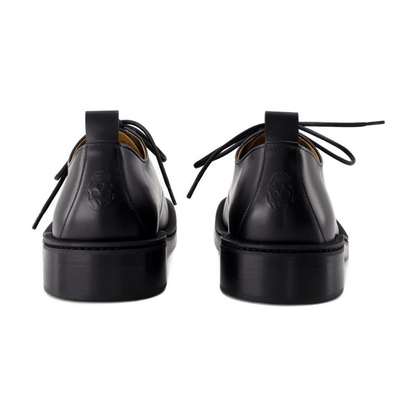 Alexander McQueen calfskin derby in black