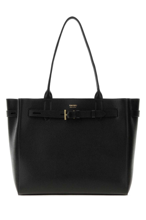 Tom Ford Exterior: 100% Bovine leather; Lining: 100% Polyester; Finishing: Golden metal tote bag in black