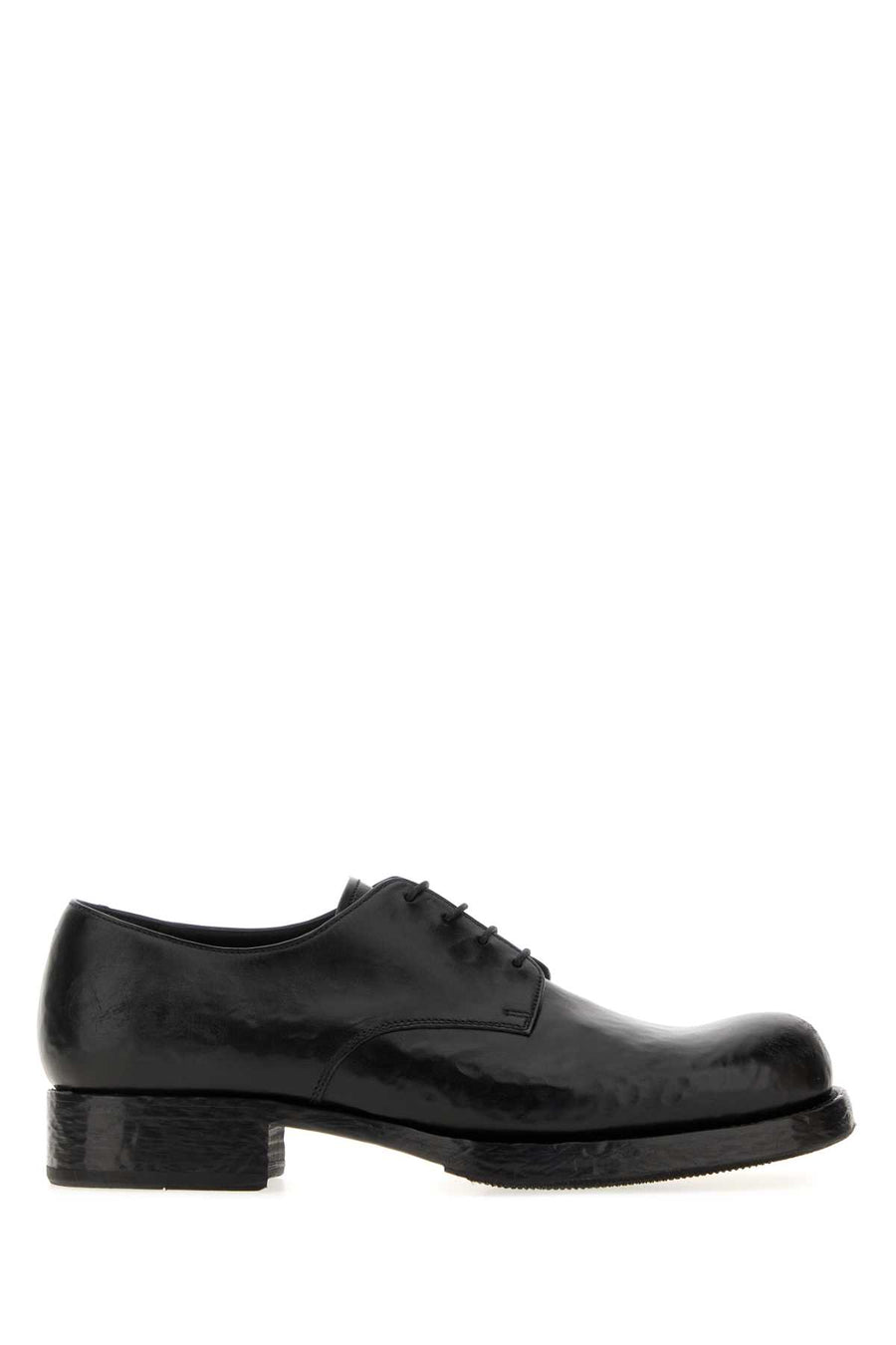 Prada Exterior: 100% Vitello (Calfskin); Interior: 100% Leather; Sole: Rubber loafer in black