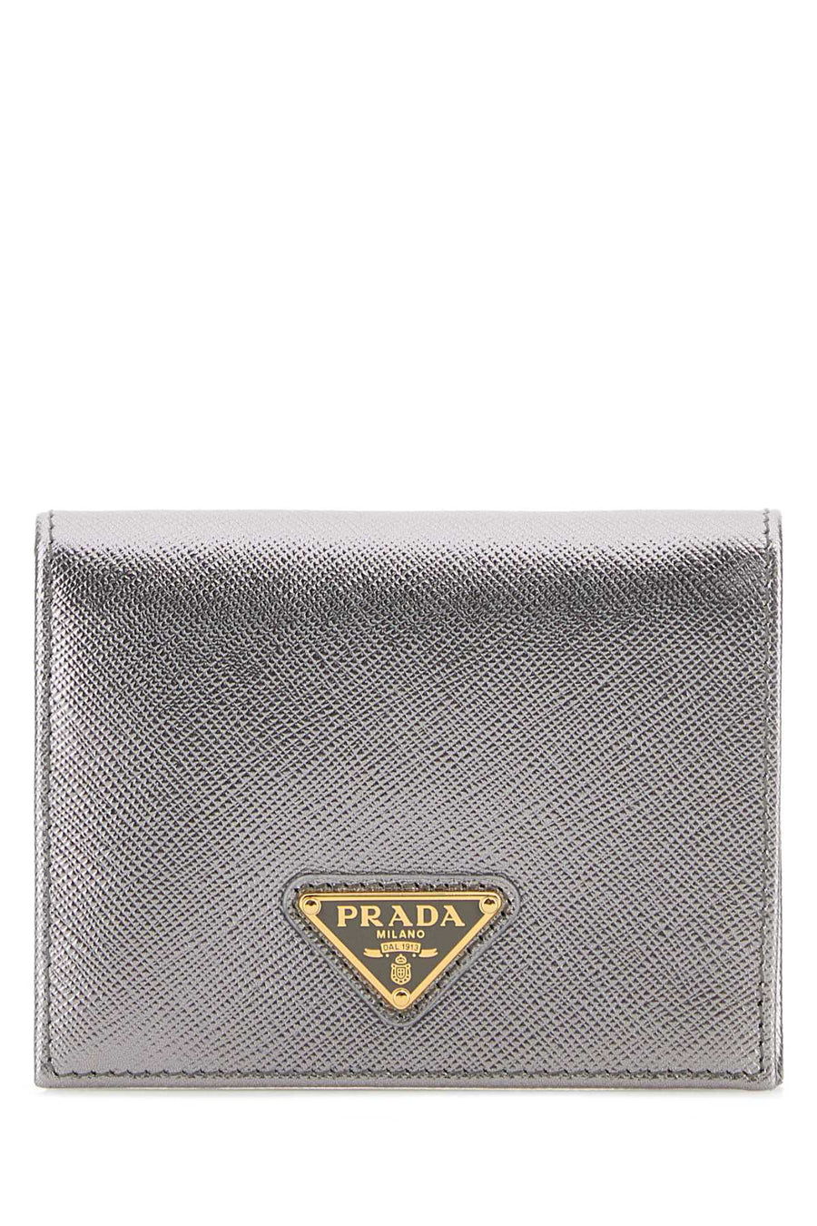 Prada Exterior: 100% Leather; Finishing: Golden metal wallet in silver