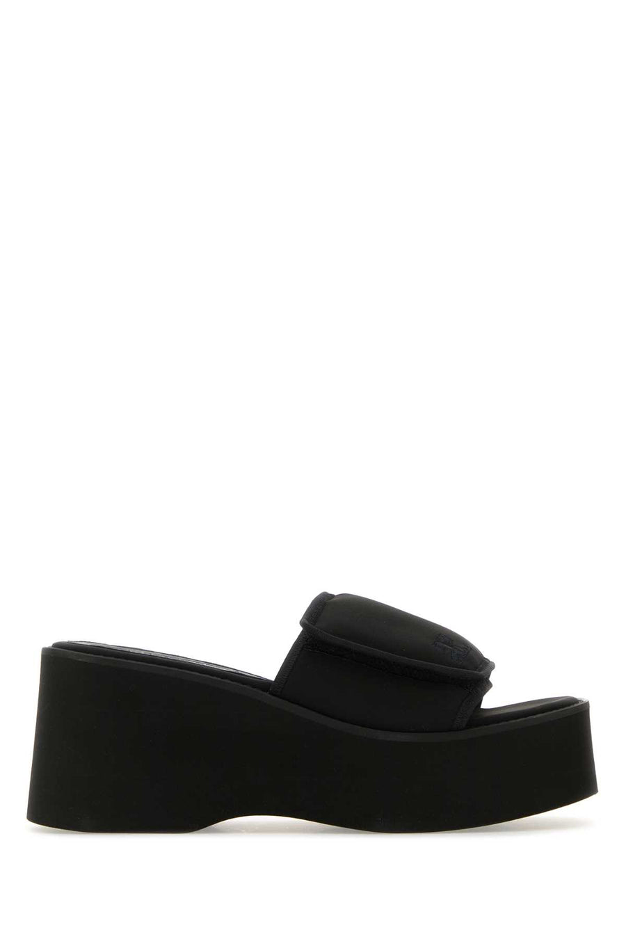 Courreges Exterior: 54% Polyester 38% Nylon 8% Elastane; Interior: 100% Leather 100% Fabric; Sole: Rubber slipper in black