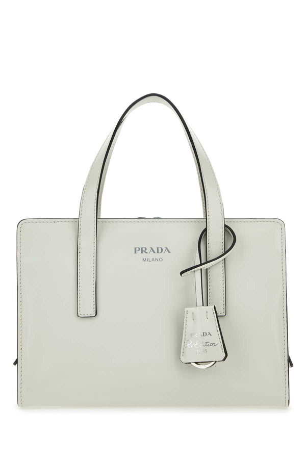 Prada 100% Vitello (calf leather) top handle bag in white