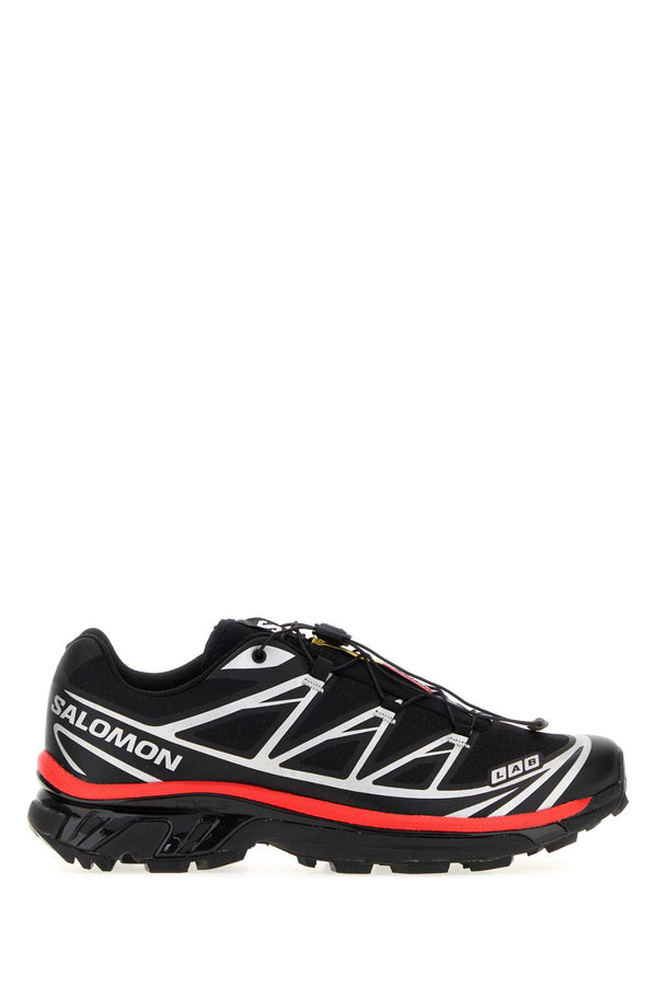 Salomon Exterior: 100% Fabric 100% Rubber. Interior: 100% Fabric. Sole: Rubber sneaker in black