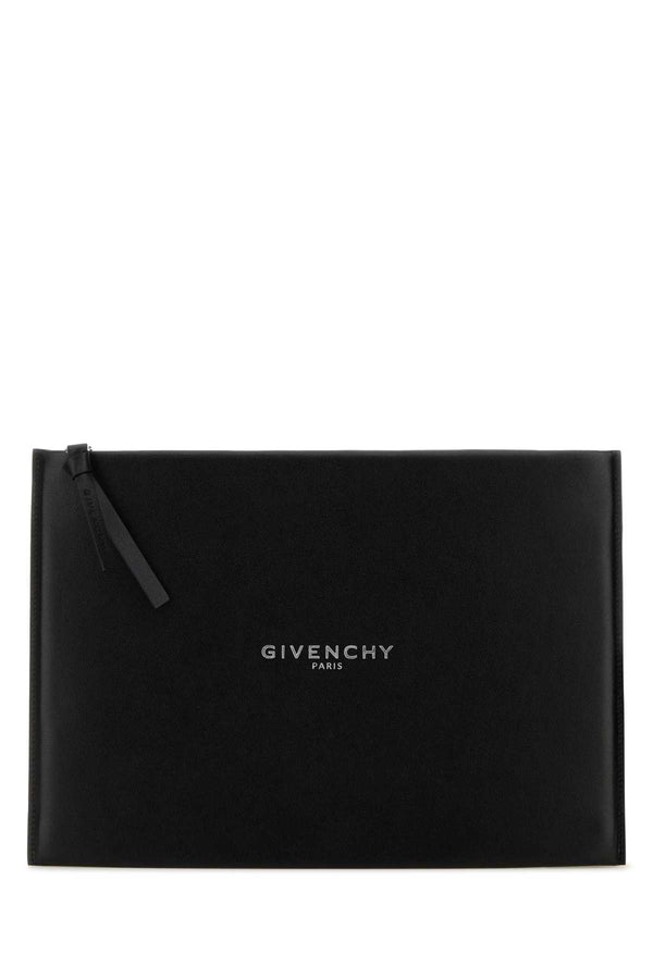 Givenchy Exterior: 100% Calf Lining: 100% Fabric Finishing: Silver metal clutch in black