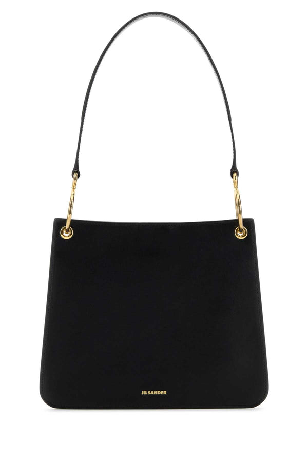 Jil Sander Exterior: 100% Ovine leather; Lining: 100% Leather; Finishing: Golden metal shoulder bag in black