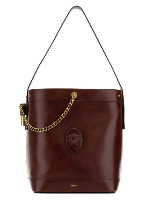 Versace Exterior: 100% Calf; Lining: 100% Leather; Finishing: Antiqued golden metal shoulder bag in brown