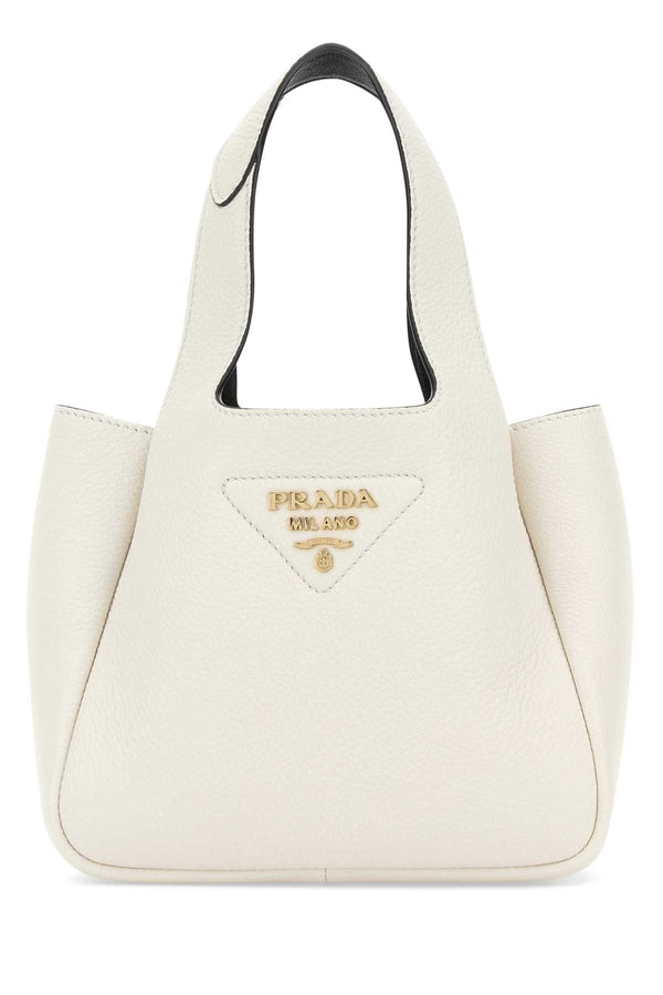 Prada Exterior: 100% Leather; Lining: 100% Leather; Finishing: Golden metal shoulder bag in white