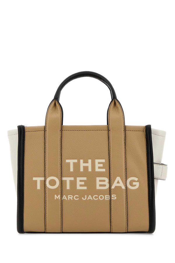 Marc Jacobs Mano Exterior: 100% Bovine leather; Lining: 100% Leather; Finishing: Silver metal tote bag in beige
