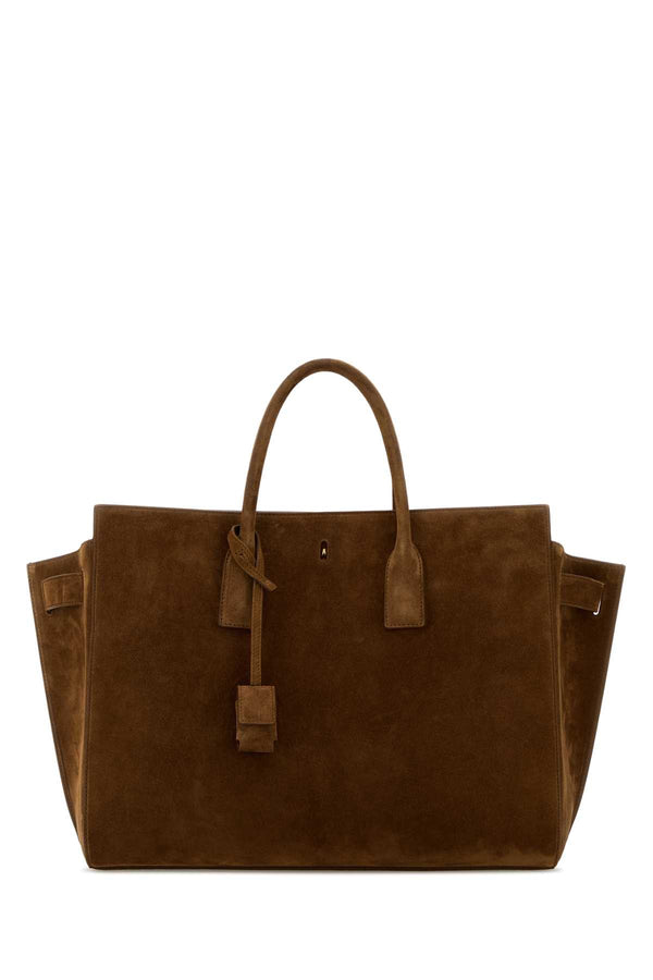 Saint Laurent Exterior: 100% Calf Suede. Lining: 100% Leather. Hardware: Antiqued golden metal tote bag in brown