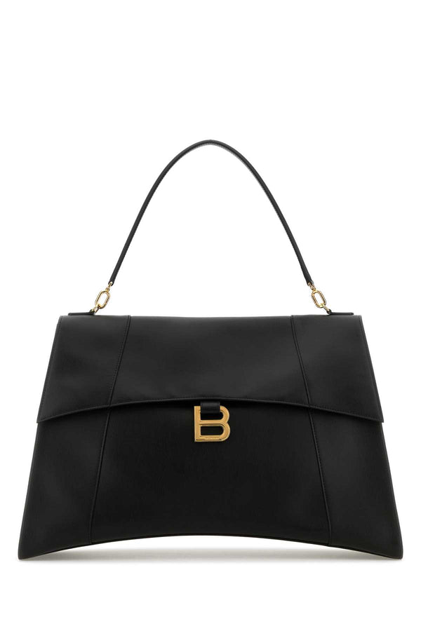 Balenciaga Exterior: 100% Calf Leather; Lining: 100% Leather; Finishing: Golden metal top handle bag in black