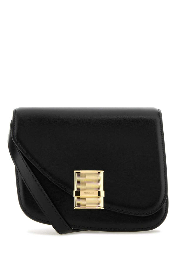 Ferragamo Exterior: 100% Leather; Lining: 100% Leather; Finishing: Golden metal crossbody bag in black