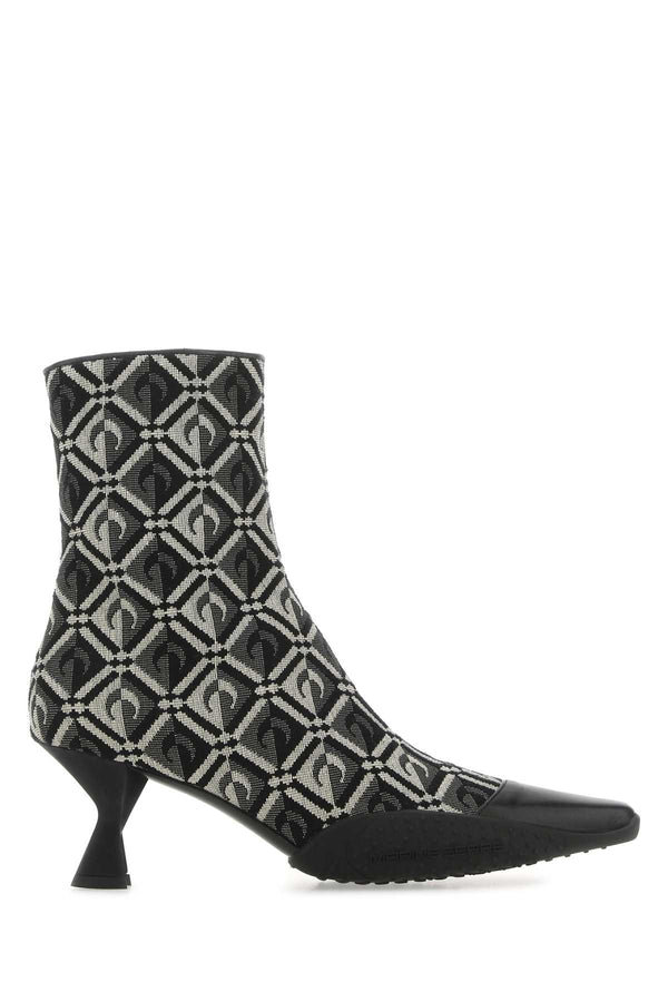 Marine Serre Exterior: 97% Cotton 3% Polyester; Interior: 100% Leather; Sole: Rubber boot in black