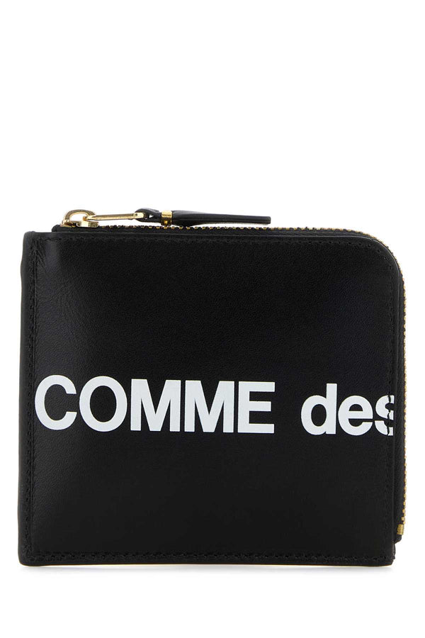 Comme des Garçons Logo Exterior: 100% Leather; Finishing: Golden metal wallet in black