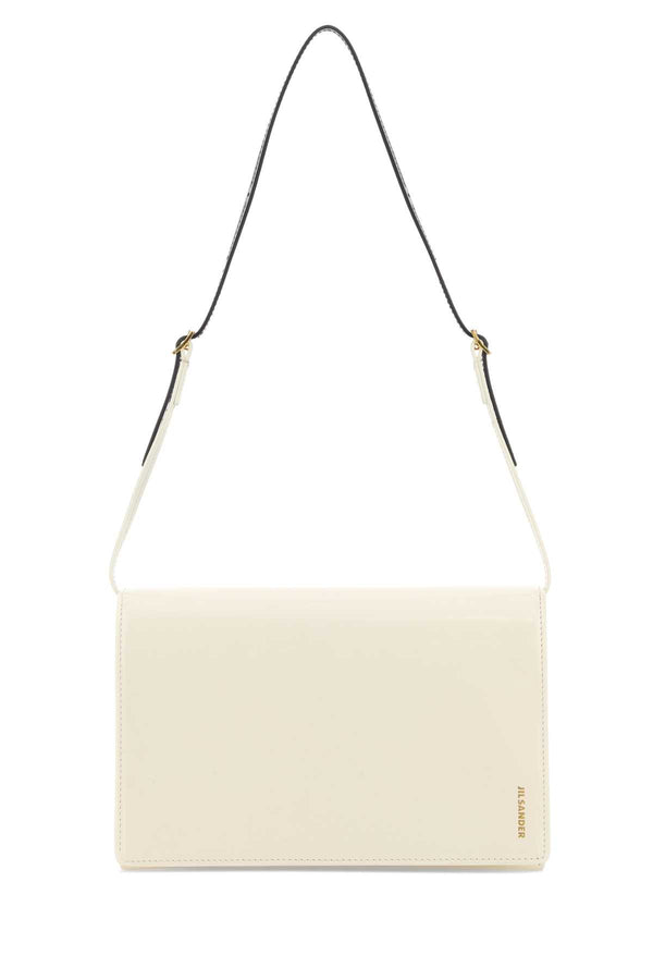 Jil Sander Exterior: 100% Calf. Lining: 100% Leather. Finishing: Golden metal shoulder bag in white