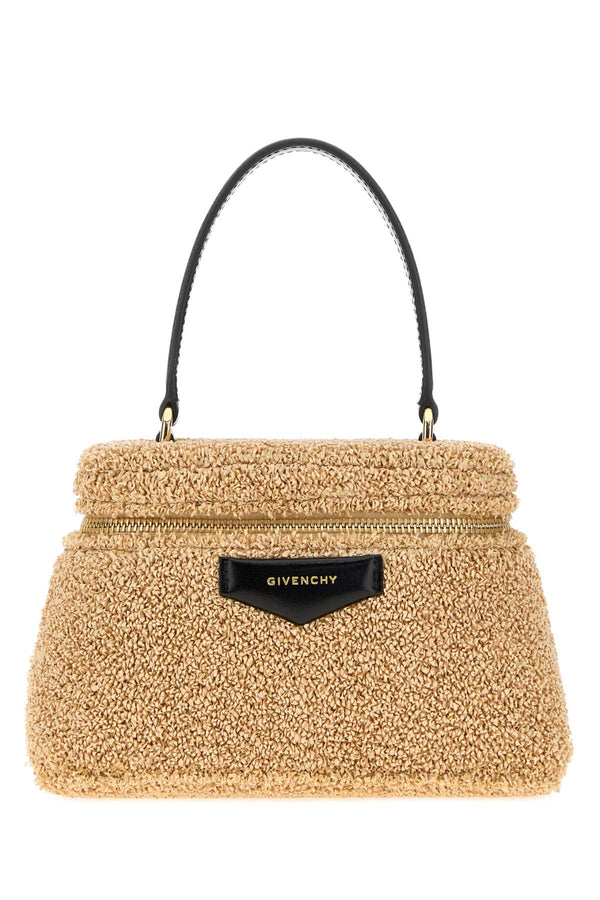 Givenchy Exterior: 62% Nylon 31% Cotton 7% Elastane; Lining: 51% Polyurethane 49% Cotton top handle bag in beige