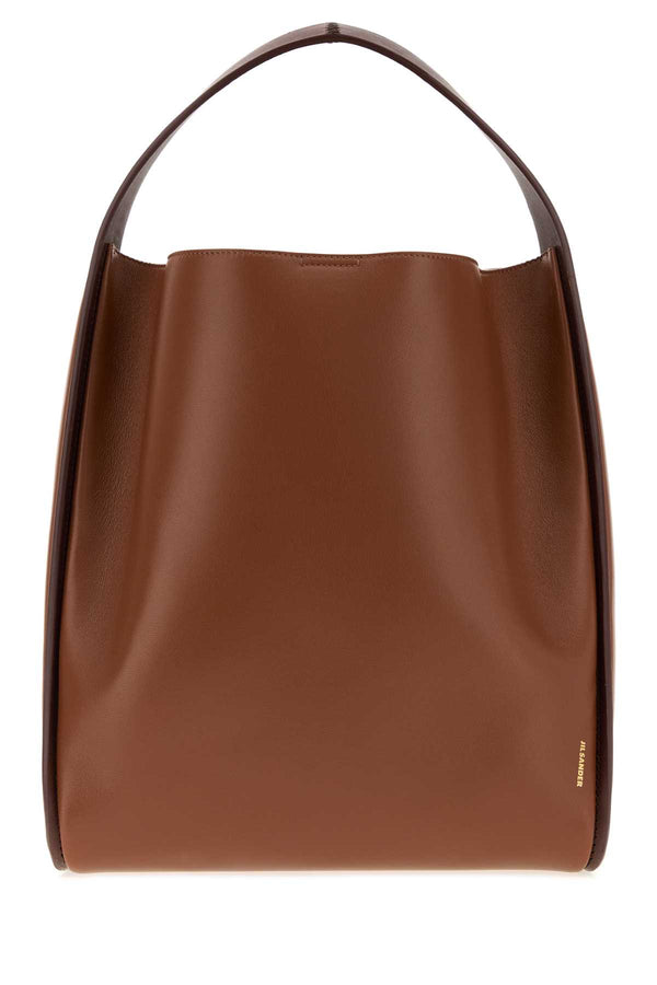 Jil Sander Tote Exterior: 100% Ovine leather bucket bag in brown