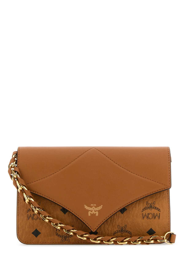 MCM Bril Exterior: 100% Canvas and Leather; Lining: 100% Fabric; Hardware: Golden metal crossbody bag in cognac
