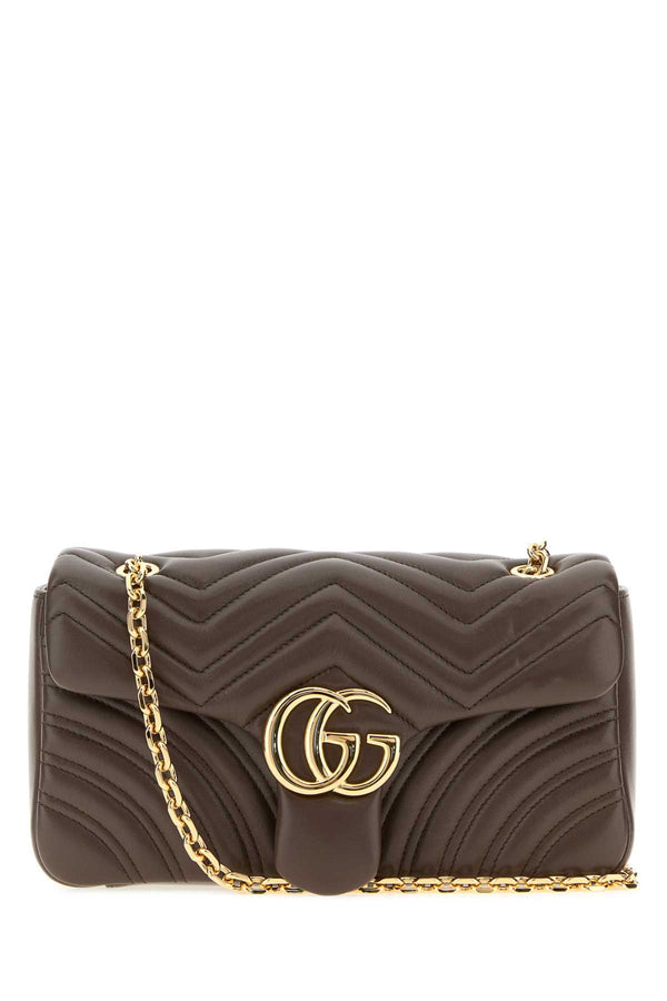 Gucci Marmont Exterior: 100% Nappa leather; Lining: 100% Fabric; Finishing: Golden metal shoulder bag in brown