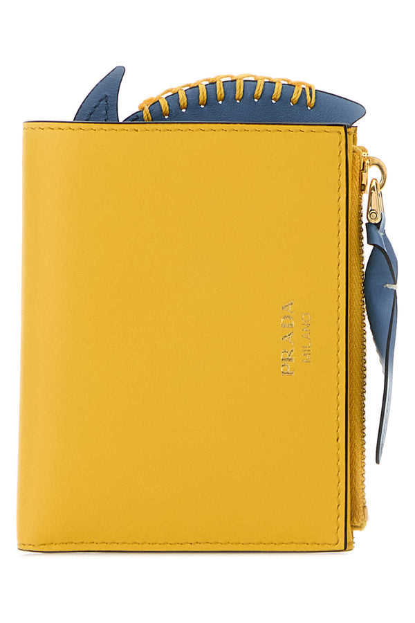 Prada Lampo Exterior: 100% Calf; Finishing: Golden metal wallet in yellow