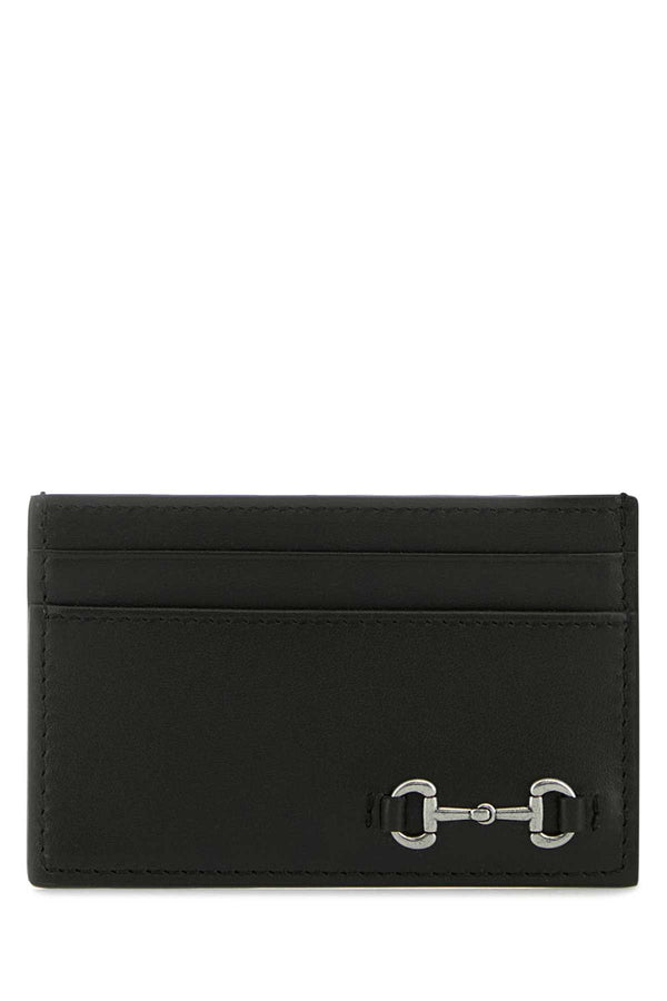 Gucci Exterior: 100% Calf; Finishing: Silver metal card case in black