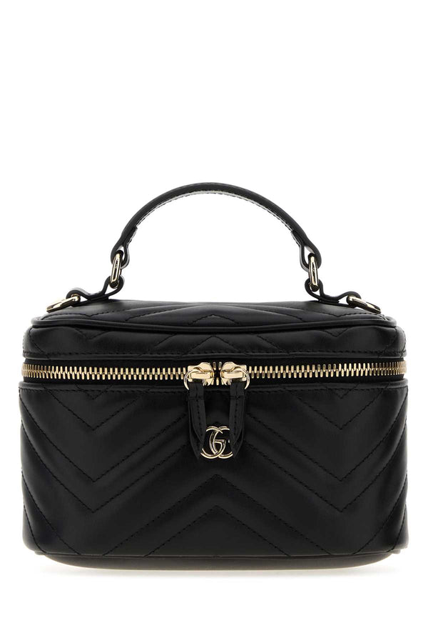 Gucci Exterior: 100% Leather; Lining: 100% Fabric; Finishing: Platinum top handle bag in black