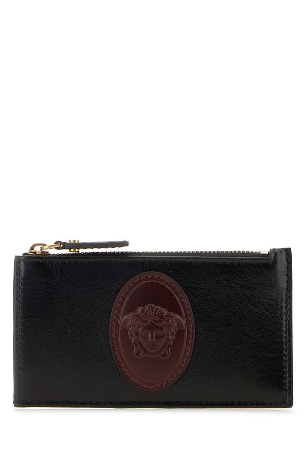 Versace Card Exterior: 100% Calf. Finishing color: Gold card case in black