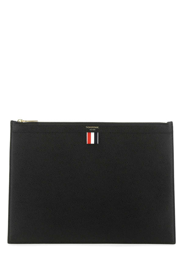 Thom Browne Documenti Exterior: 100% Leather; Lining: 100% Fabric; Finishing: Golden metal clutch in black