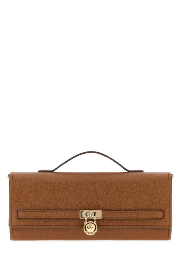 Michael By Michael Kors Clutch Exterior: 100% Leather top handle bag in brown