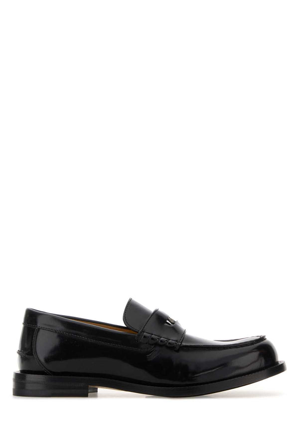 Gucci Exterior: 100% Leather; Interior: 100% Leather; Sole: Leather and Rubber loafer in black