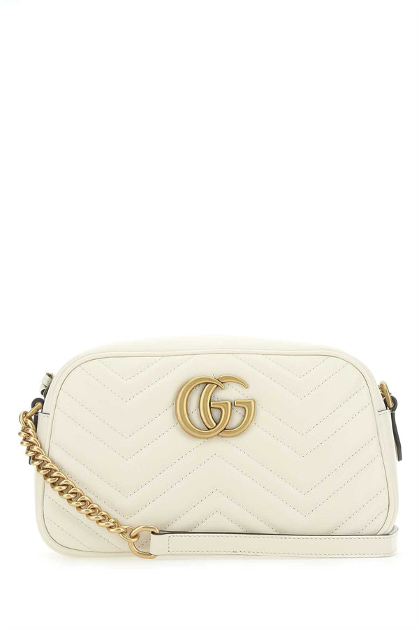 Gucci Exterior: 100% Leather; Lining: 100% Microfiber; Finishing: Antiqued golden metal crossbody bag in white