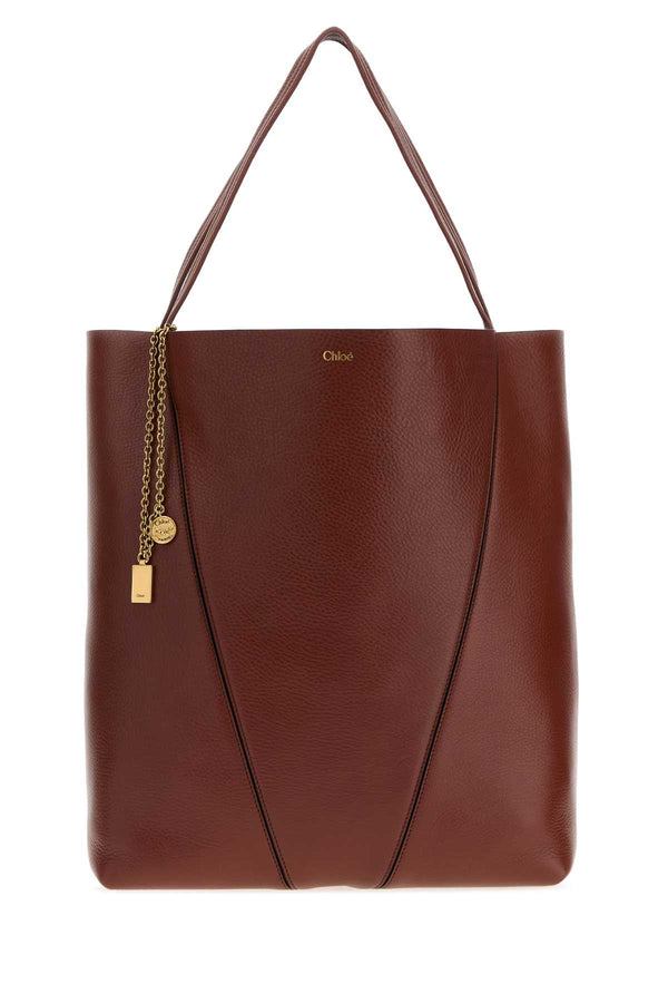 Chloé Chloé Exterior: 100% Calf Leather; Lining: 100% Leather; Finishing: Antiqued golden metal tote bag in brown