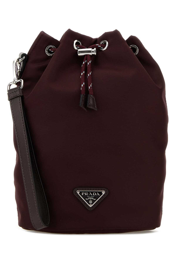 Prada Exterior: 100% Fabric; Lining: 100% Fabric; Finishing: Silver metal clutch in burgundy