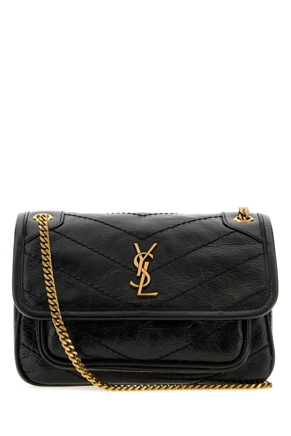 Saint Laurent Niki Exterior: 100% Calf Lining: 100% Fabric Finishing: Antiqued golden metal shoulder bag in black