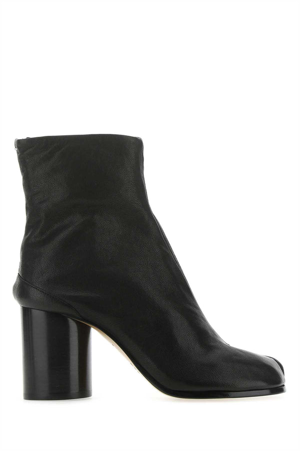 Maison Margiela Upper: 100% Sheep Leather; Lining: 100% Bovine Leather; Insole: 100% Bovine Leather; Sole: 100% Bovine Leather; Trim: 100% Rubber boot in black